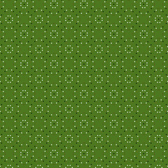 Bright abstract geometric pattern with white, black and red polka dots on a green background
