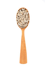 Peeled sunflower seeds in a wooden spoon isolated on white background. File contains clipping path.
