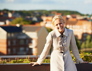 Woman, fashion and laugh for winter, city and portrait on morning sunrise, smile and outdoor....