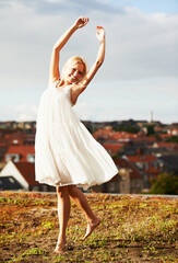 Woman, joyful and dancer on vacation, summer and outdoor for holiday, smiling and dress. Rooftop,...
