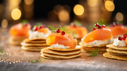 Luxurious smoked salmon blinis with a dot of creme fraiche, Christmas party, blurred background, with copy space