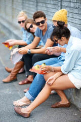 Fototapeta premium Street, friends and people with animal mask for fashion party, bonding and talking. Group, sunglasses and dress up in city, stylish men and women or hipsters sitting outdoor together for Halloween