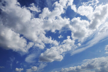 Wonderful blue sky with air white clouds. Beautiful heavenly background.
