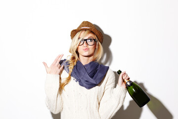 Woman, blonde and hat with champagne of nerd, geek or hipster thinking against a studio background....