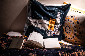 A quiet and introspective moment as a writer pens their thoughts in a diary during the peaceful...