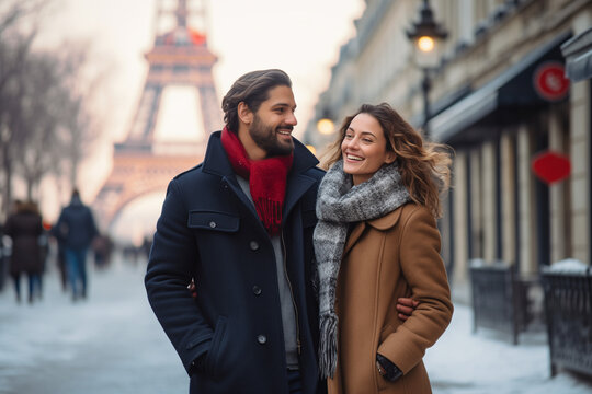Happy smiling couple, an Eiffel Tower in the background, in christmas afternoon