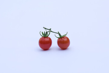 Fresh red tomatoes on a white background