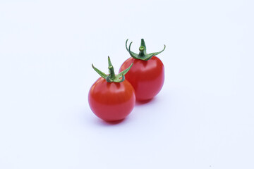 Fresh red tomatoes on a white background