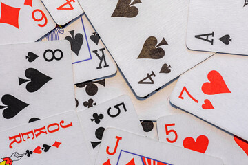 Mixed playing cards on a table, concept for card game or gambling games