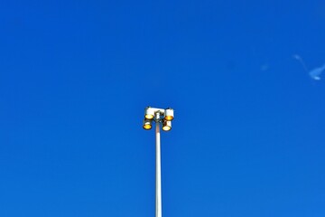 Street lights in the city of cape town during clear blue sky.