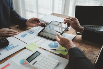 Businessmen are attending a meeting about finances, Discussing tax payments in the conference room, Meeting to plan marketing to increase operating results, Business meeting idea.