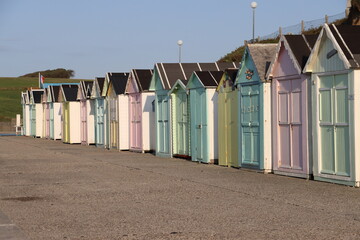 colorful beach huts in Normandy