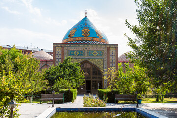 Blue Mosque building in green courtyard in Yerevan city on sunny autumn day. The Blue Mosque is...