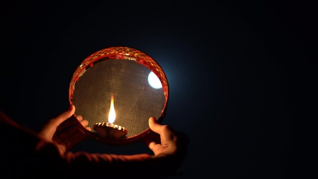 Karwa Chauth strainer and Diya oil lamps for the Karwa Chauth celebration on the night