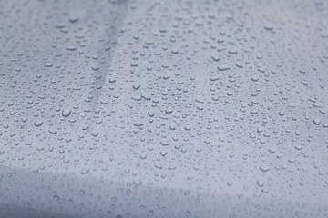 Droplets on the car surface.