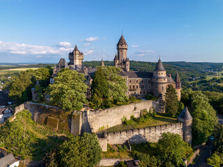 Medieval castle in Braunfels, Hesse, Germany, with many later additions. Aerial view in summer in sunset light