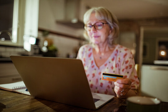 Senior woman online shopping on her laptop at home
