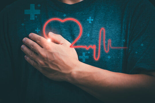 A person is showing a virtual heartbeat on their hand. To express treatment, concepts, treatment and health care Physical changes, health data connectivity on the internet, various data storage