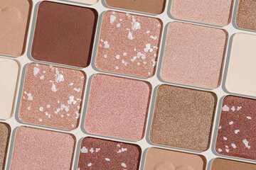 Eye shadows beige color swatches, creative cosmetic texture background, different shiny and matte eyeshadow, trend geometric pattern, aesthetic beauty template, neutral color powder for makeup