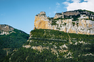 Fototapeta na wymiar Cliffs at the entrance of the Vallon de Combeau nature reserve near Chatillon en Diois in the south of France