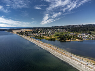 Esquimalt lagoon aerial looking towards Royal bay new development and the Olympic Mountains in Washington USA on Vancouver Island Canada.