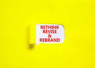 Rethink revise rebrand symbol. Concept word Rethink Revise and Rebrand on beautiful white paper. Beautiful yellow background. Business brand motivational rethink revise rebrand concept. Copy space.