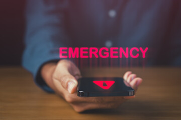 Urgent Emergency Alert Phone for Rapid Response. phone on the table with emergency and alert icon. Accident and Dial hotline 911 concept.