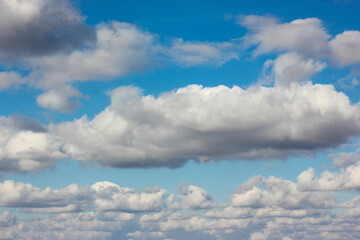 Naklejka na ściany i meble The blue sky and white clouds create a tranquil atmosphere