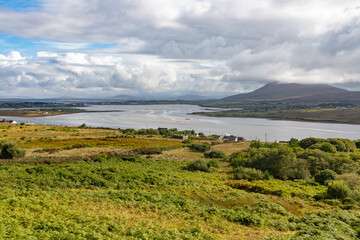 Houses, Vegetation, mountains and ocean in Achill Island