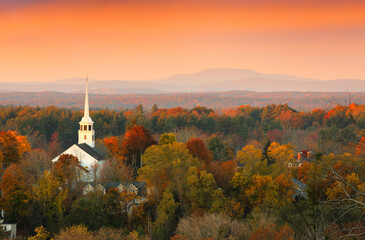 Overlooking a peaceful New England Farm in the autumn at sunrise with frost on foreground, Boston,...