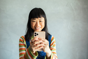 Joyful woman capturing a moment with her smartphone
