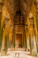 Vault and columns in one of the temples of the mysterious city of Angkor in Cambodia.