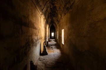 Ancient and mysterious passageway and vault in one of the temple areas of Angkor Wat in Cambodia,...