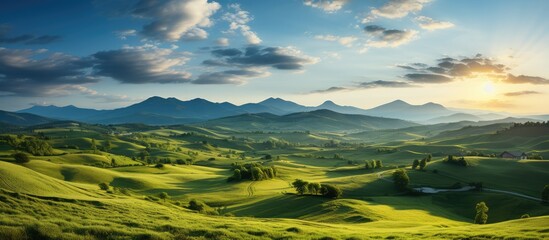 panorama of meadow at sunset in soft light. beautiful spring view in the hills. Meadow. rural view