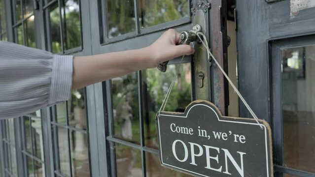 hand on handle door for open to entering restaurant