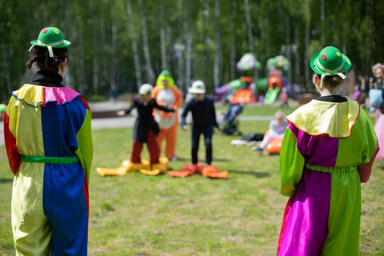 Children's party. Children's animators. Holding fun holiday on street.