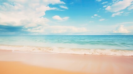 Fototapeta na wymiar Beautiful natural tropical summer beach background with golden sand, turquoise ocean, and blue sky with white clouds