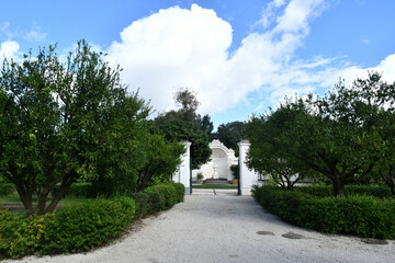 Entrance to the garden inside the park around the 18th century Bourbon palace in Naples, Italy.