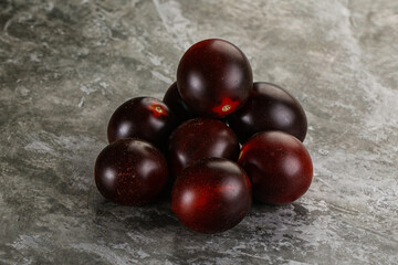 Raw ripe black kumato tomato