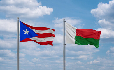 Madagascar and Puerto Rico flags, country relationship concept