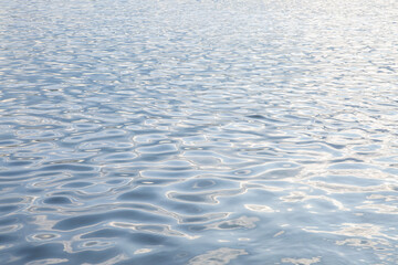 Abstract background, water surface with ripples. The texture of the water.