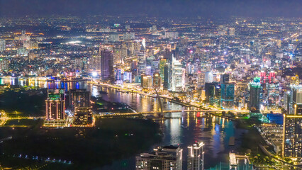 Aerial view of Ho Chi Minh City skyline and skyscrapers on Saigon river, center of heart business at downtown, cityscape in the night
