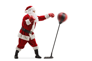 Full length profile shot of santa claus training box with a punching stand
