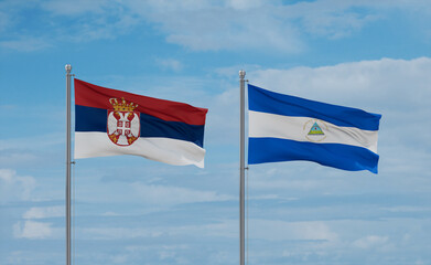 Nicaragua and Serbia flags, country relationship concept