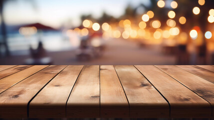empty wooden table with blurry beach bar background - obrazy, fototapety, plakaty