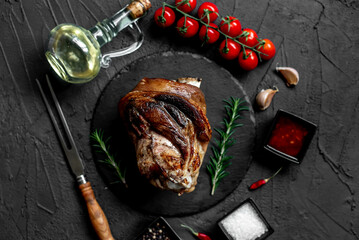 pork knuckle baked in the oven on a stone background