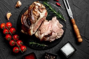 pork knuckle baked in the oven on a stone background