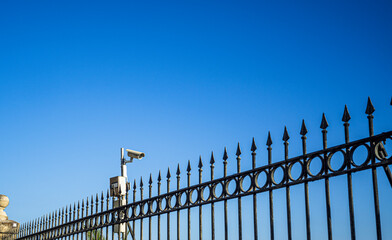 fence with security camera