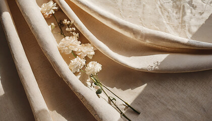 aesthetic boho wedding textile background draped neutral beige linen fabric texture with absrtact floral sunlight shadows