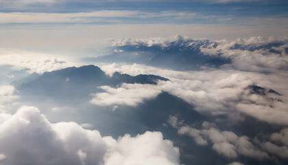 Fototapeta na wymiar a view of a mountain range in the clouds from a plane generative ai